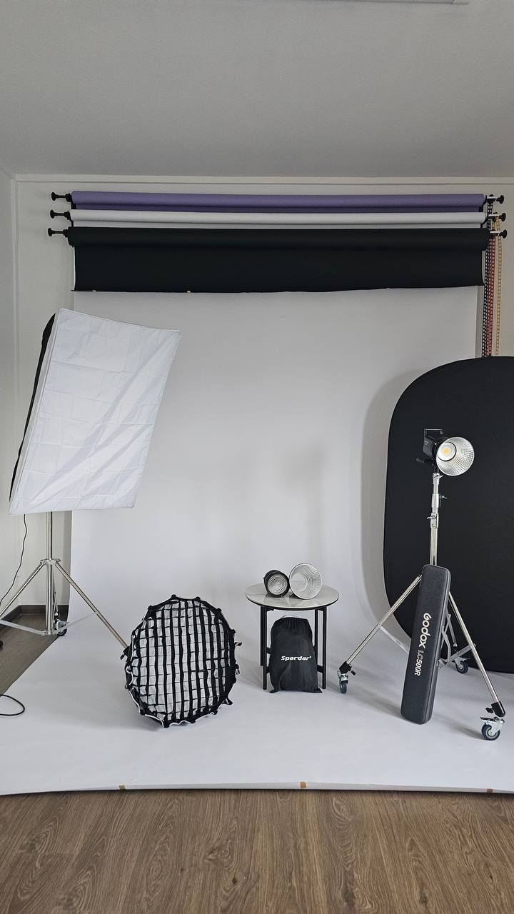 Backdrop zone with white, black and purple backdrops and studio lights